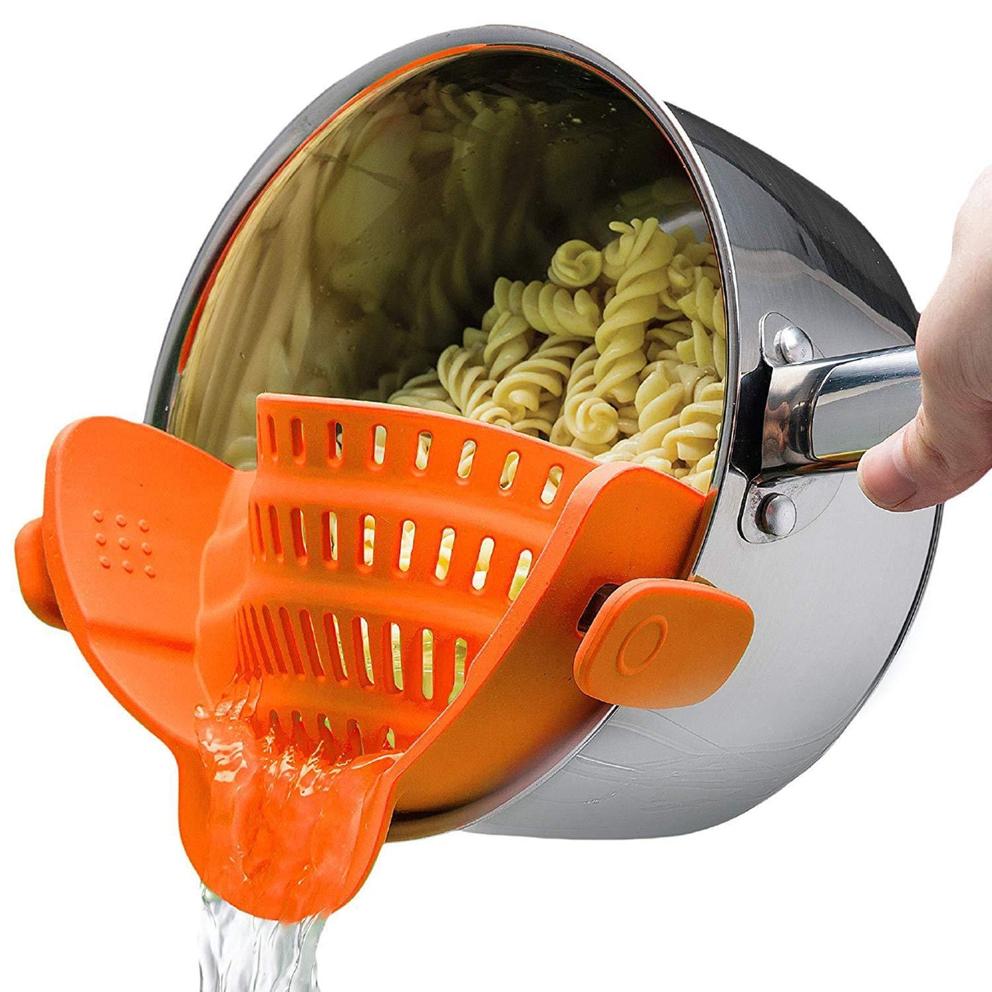 Pasta strainer with orange handle being used to drain pasta from a pot.