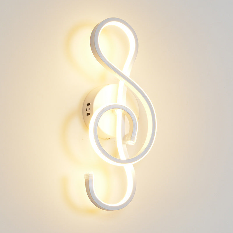 Wall lamp shaped like a treble clef on a light gray background